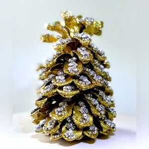 Gorgeous bejeweled pinecone in gold and rhinestones.